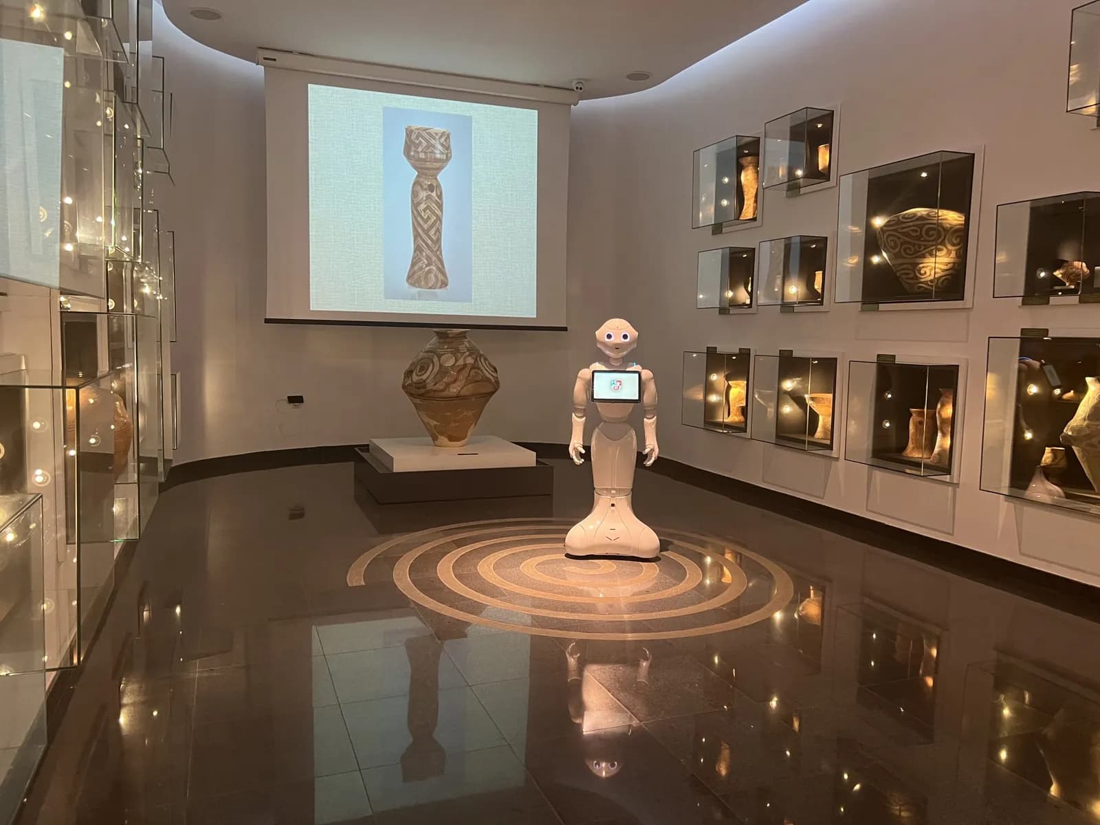 Pepper in a museum room, with exhibits in display cases