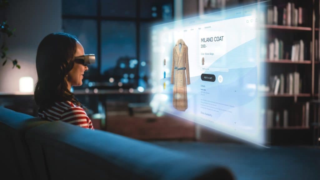 A woman wearing mixed reality glasses looks at a product page displayed in front of her